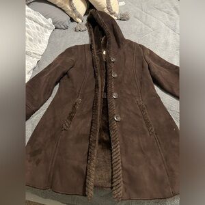Almostt like new. Worn only once. Brown coat in size small.